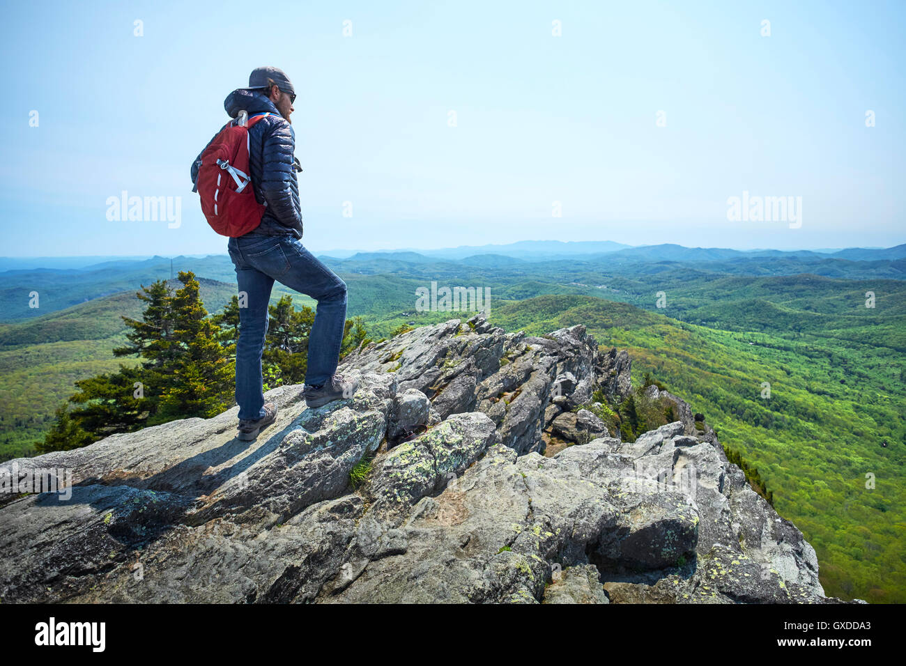 Male hiker looking out from ridge, Blue Ridge Mountains, North Carolina, USA Stock Photo