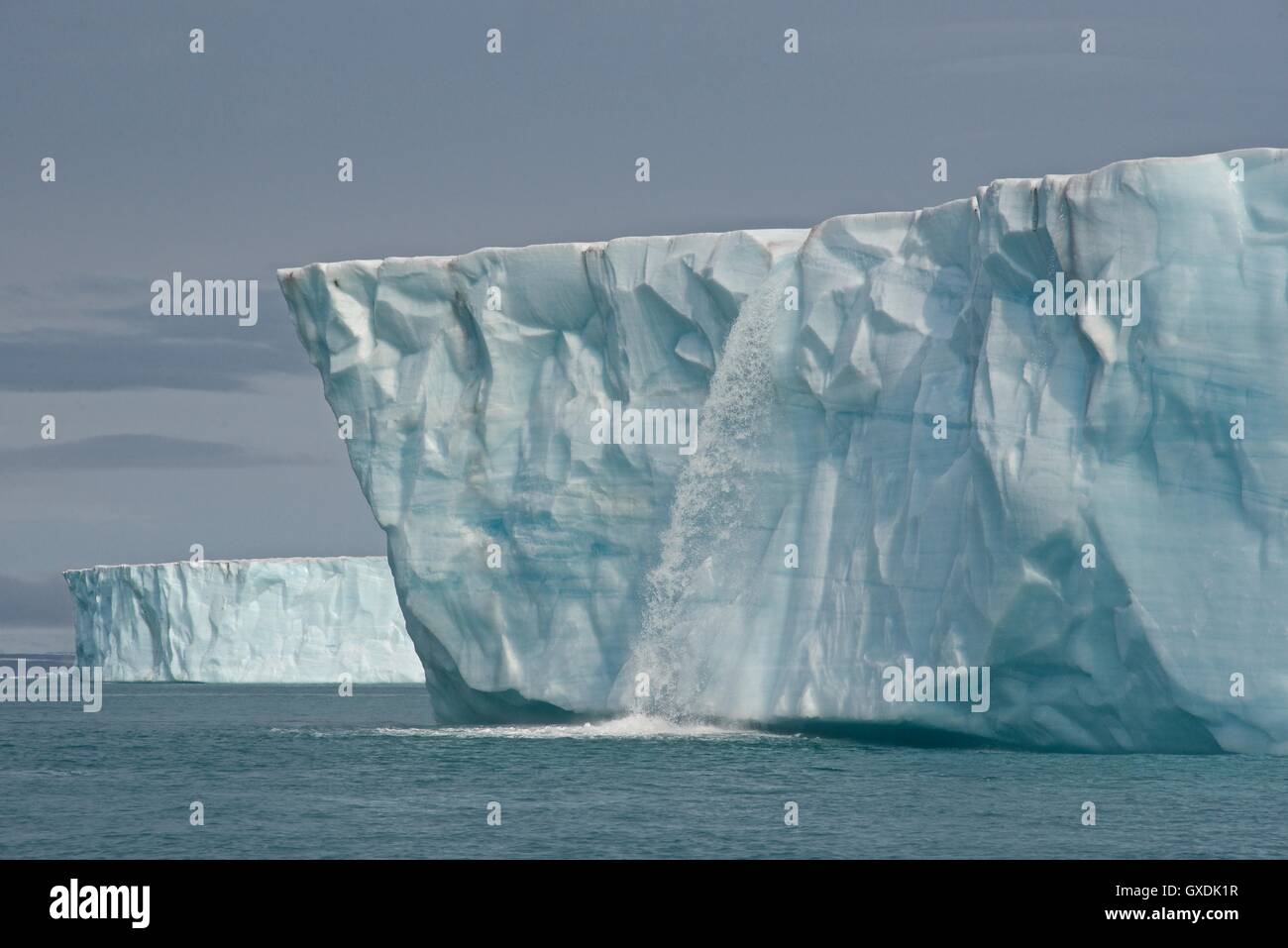 Water Pours From face of Brasvellbreen Glacier on Nordaustlandet. Svalbard Archipelago, Arctic Norway. Stock Photo