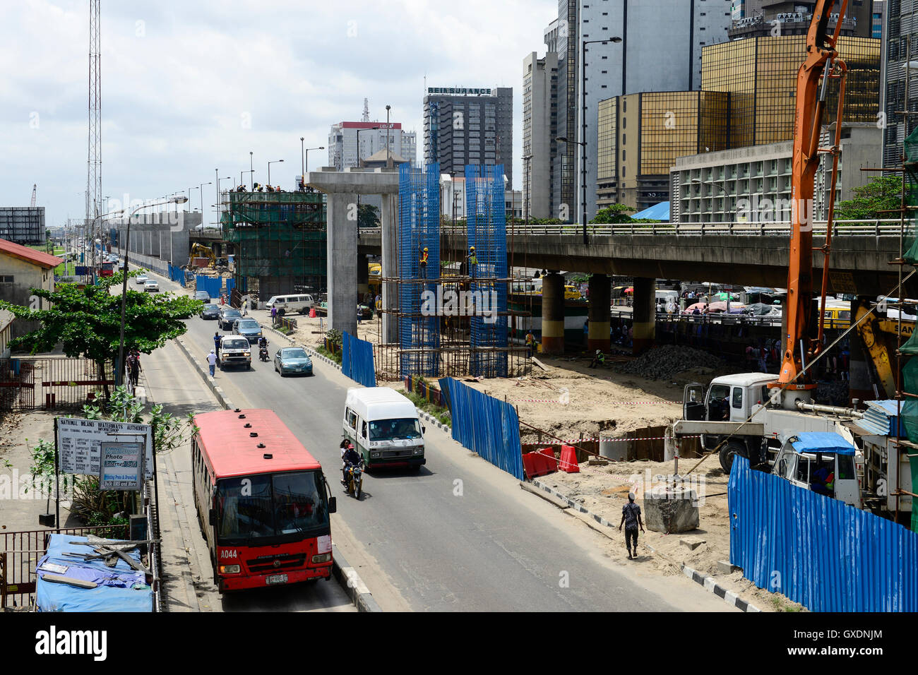 NIGERIA, City Lagos, business center and flyover construction for new metro train by chinese company CHINA CIVIL CCECC, road traffic Stock Photo