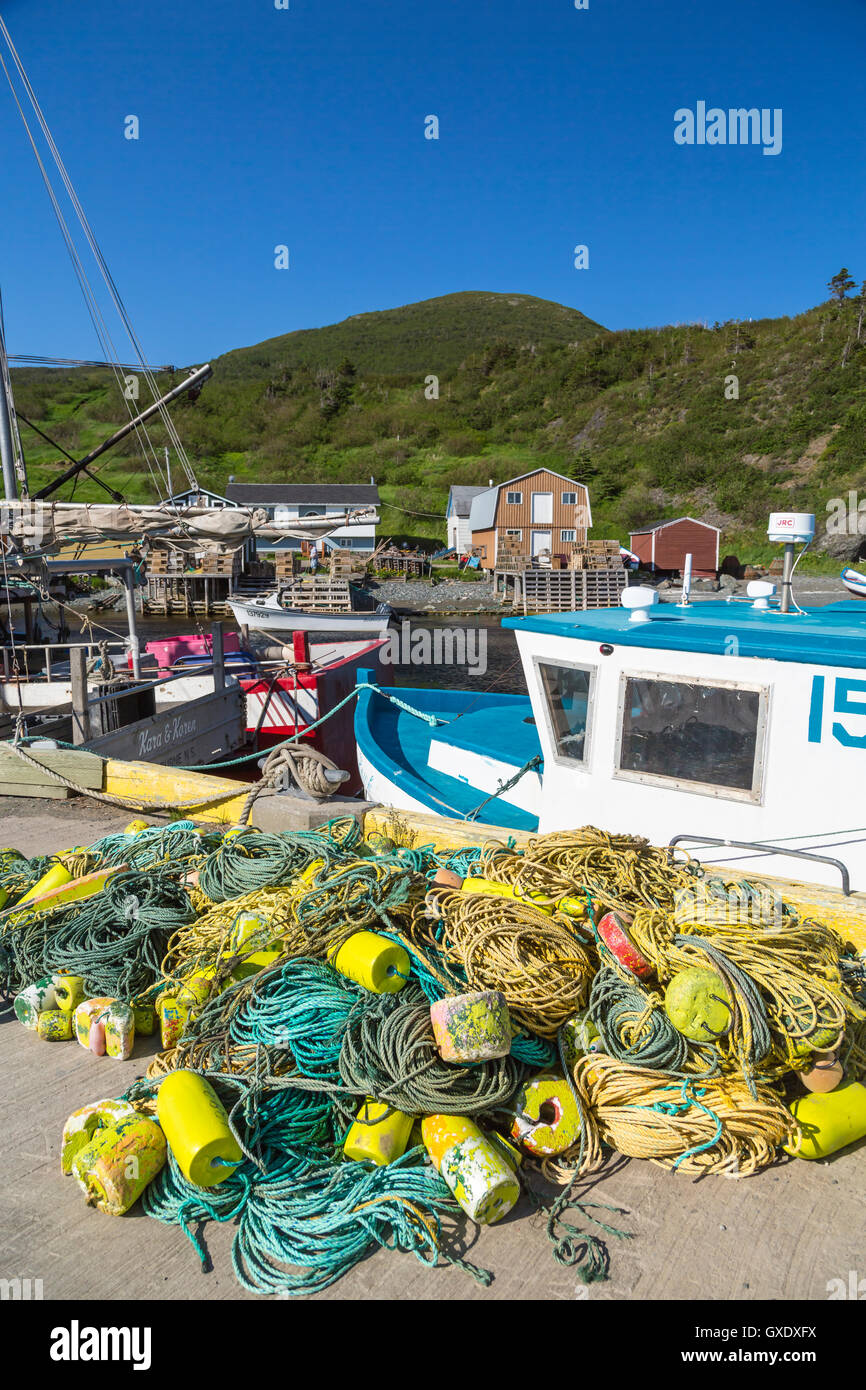 The harbor, fishing boats and colorful fishing stages in Trout River, Newfoundland and Labrador, Canada. Stock Photo