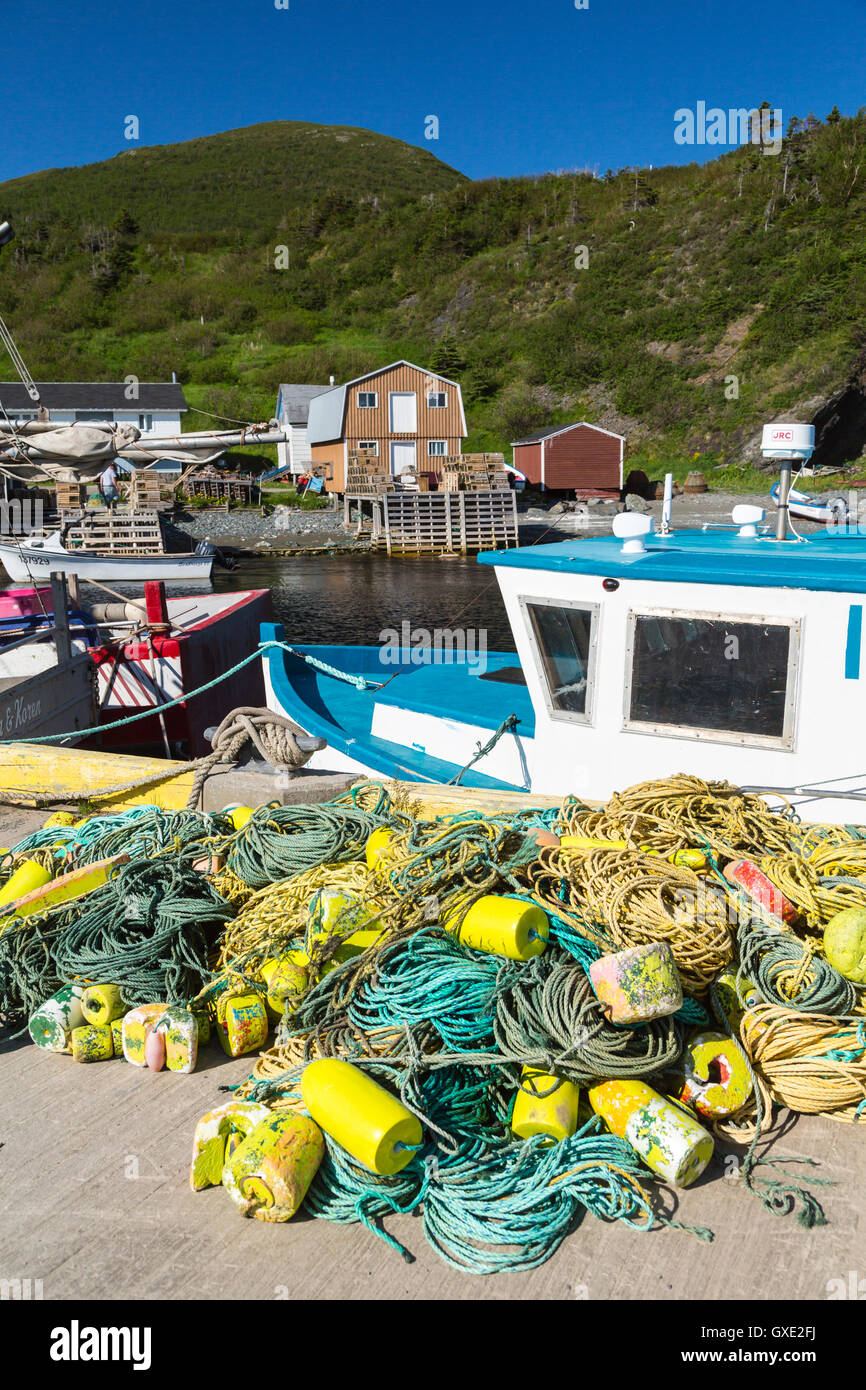 The harbor, fishing boats and colorful fishing stages in Trout River, Newfoundland and Labrador, Canada. Stock Photo