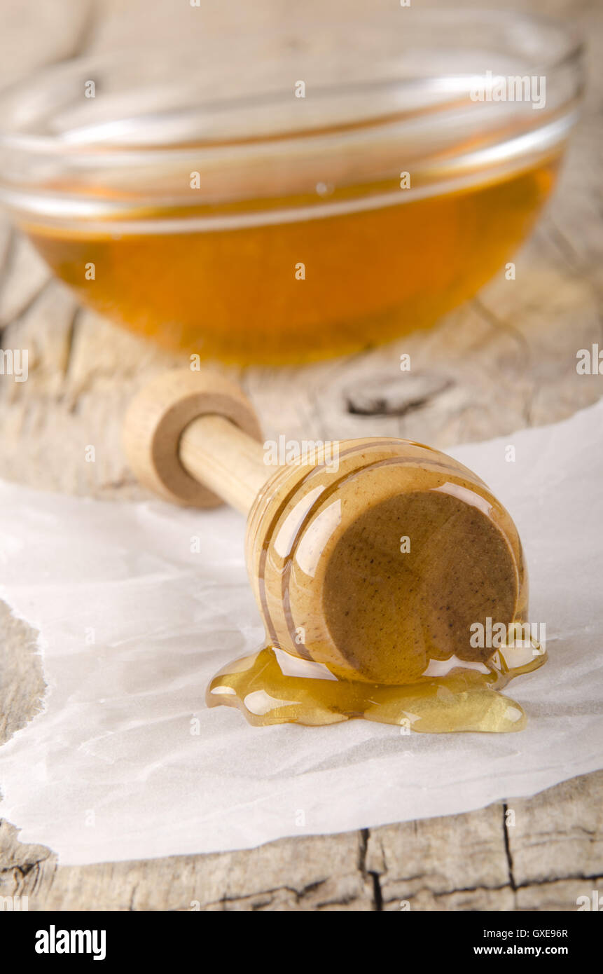 honey dripper with some bee honey Stock Photo Alamy