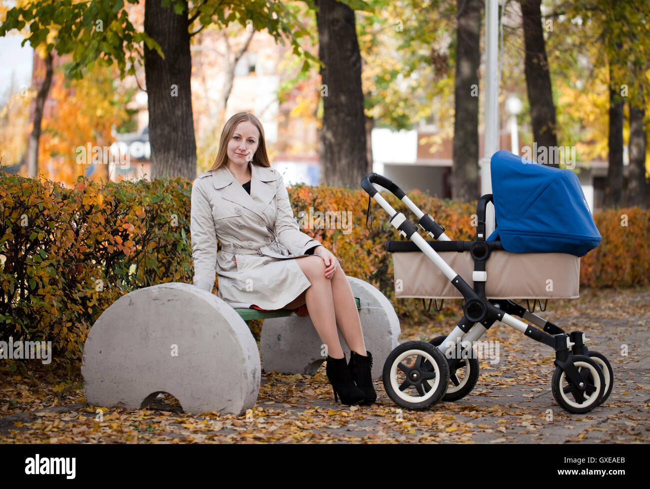 Mother with baby stroller for a newborn Stock Photo Alamy