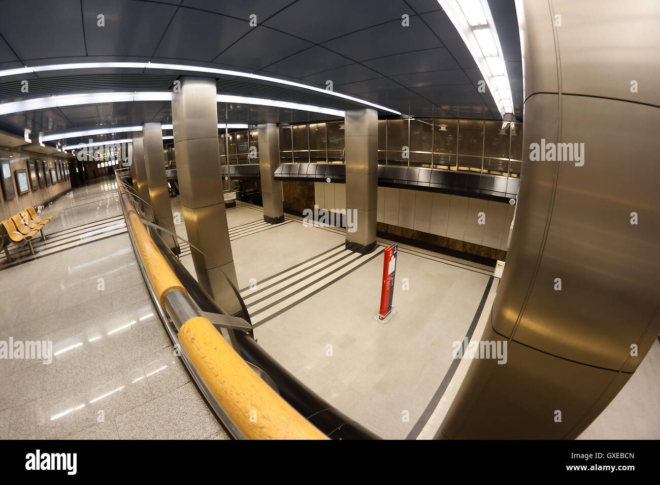 An interior of a subway station in Moscow (Russia) with arriving train. Shot with fish-eye lens. Stock Photo