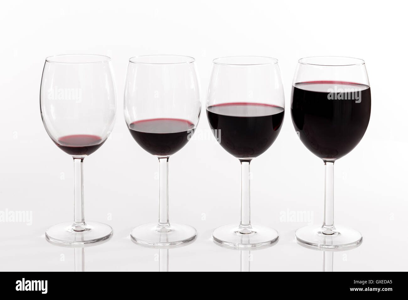 Glasses with different quantities of red wine Stock Photo Alamy