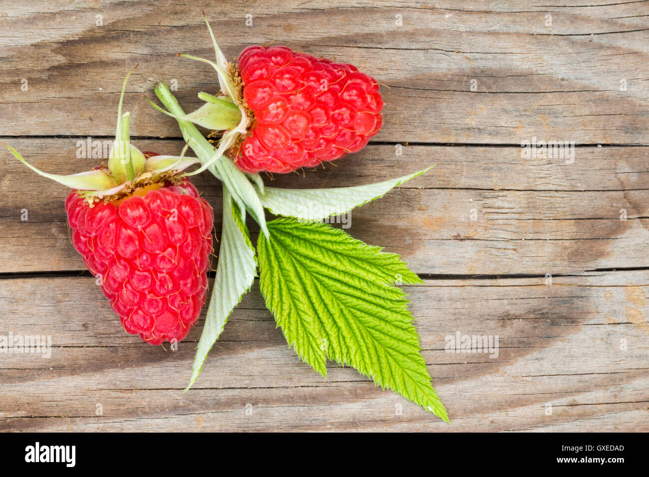 close-up of raspberries on a wooden background Stock Photo
