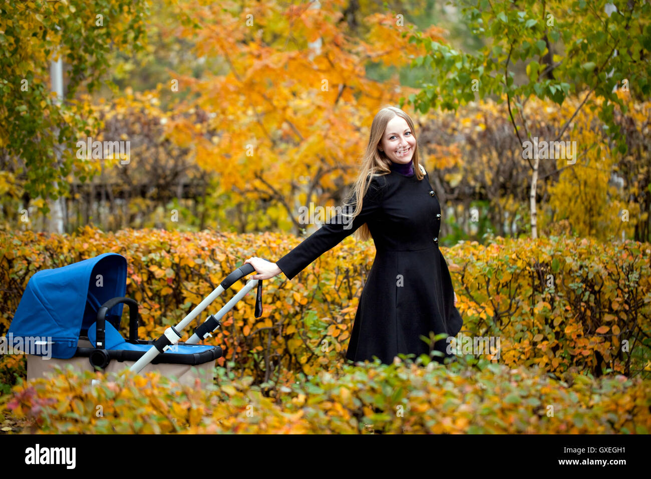 Mother with baby stroller for a newborn Stock Photo Alamy
