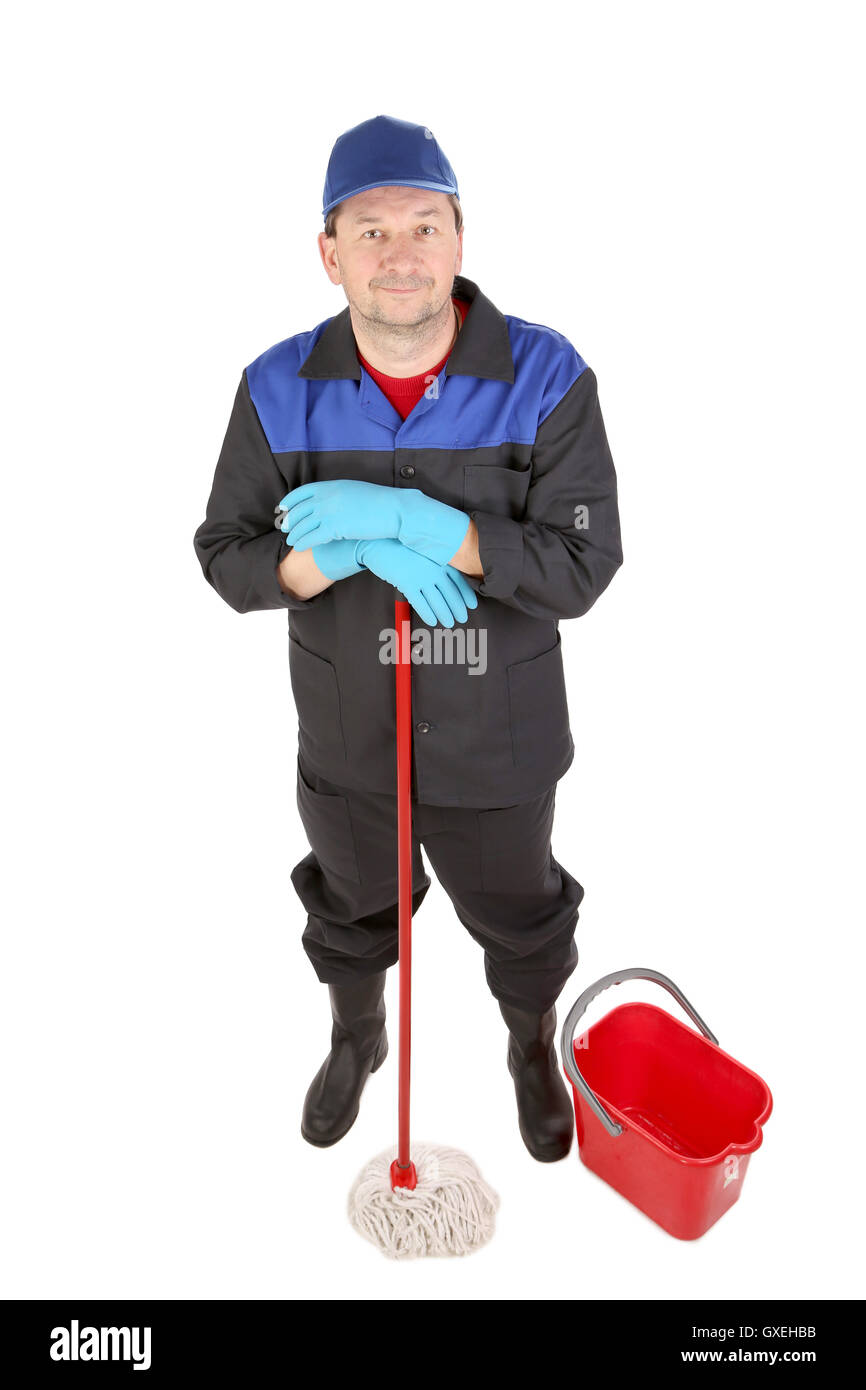 Man in workwear with bucket and mop Stock Photo