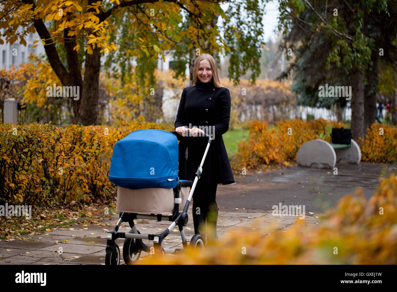 Mother with baby stroller for a newborn Stock Photo Alamy