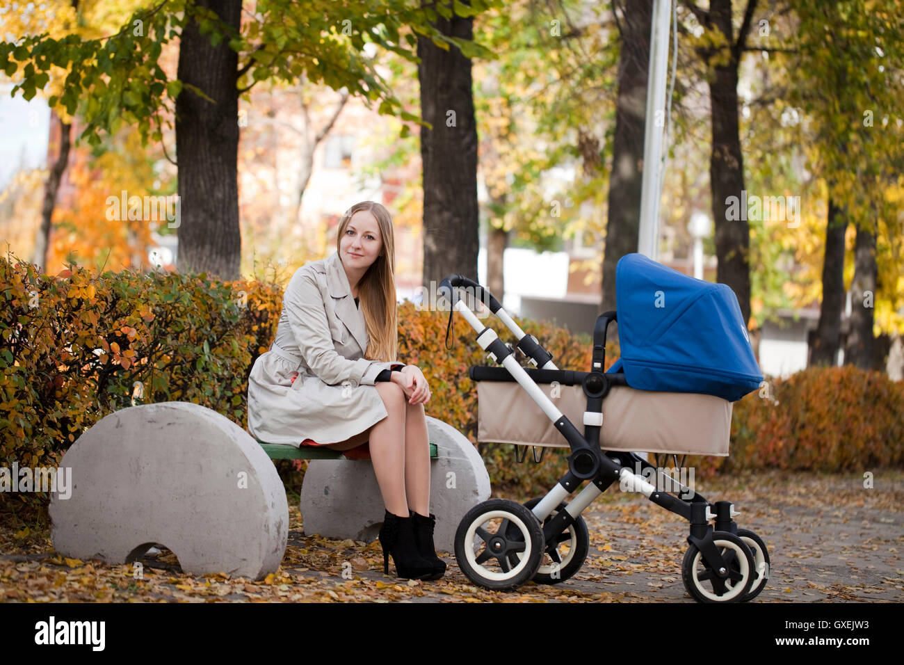 Mother with baby stroller for a newborn Stock Photo Alamy