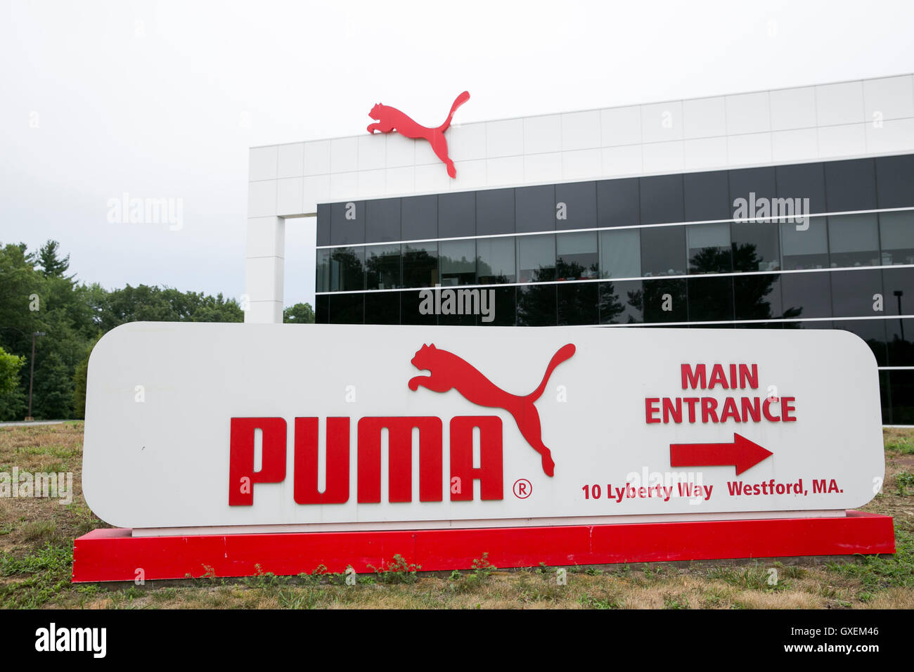A logo sign outside of the headquarters of Puma North America, Inc., in Westford, Massachusetts on August 13, 2016. Stock Photo