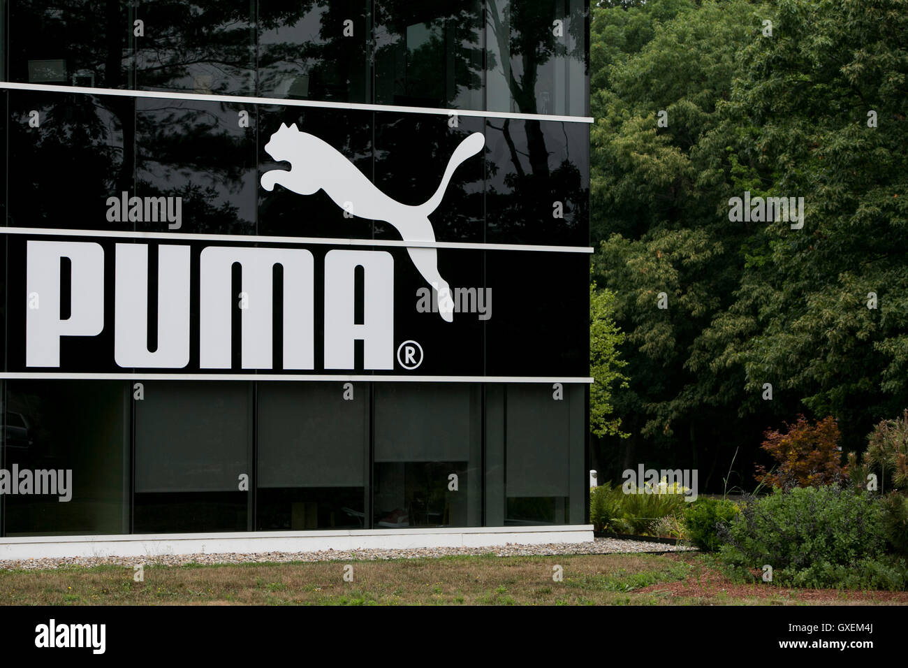 A logo sign outside of the headquarters of Puma North America, Inc., in Westford, Massachusetts on August 13, 2016. Stock Photo