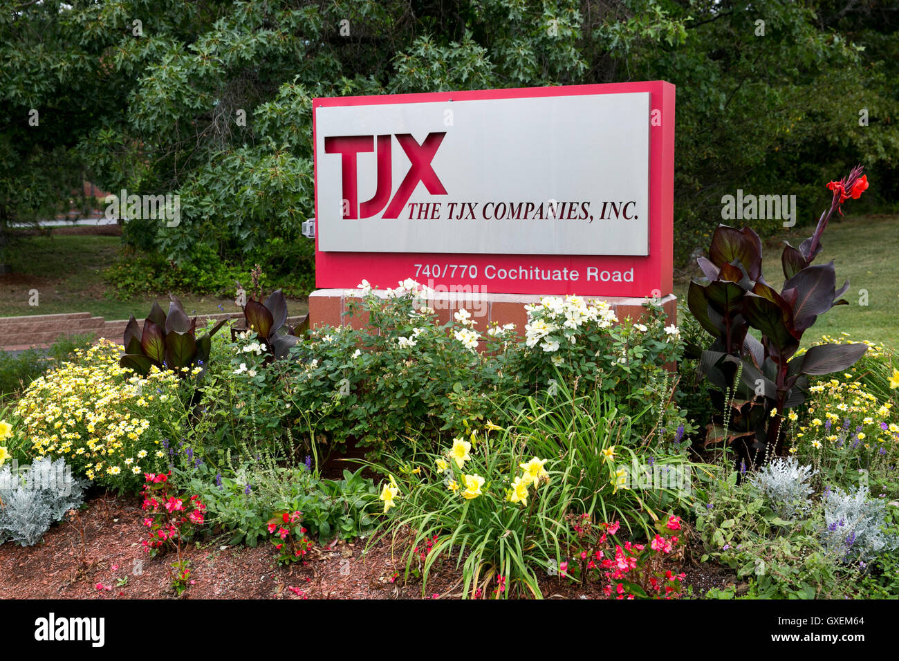 A logo sign outside of the headquarters of The TJX Companies, Inc., in