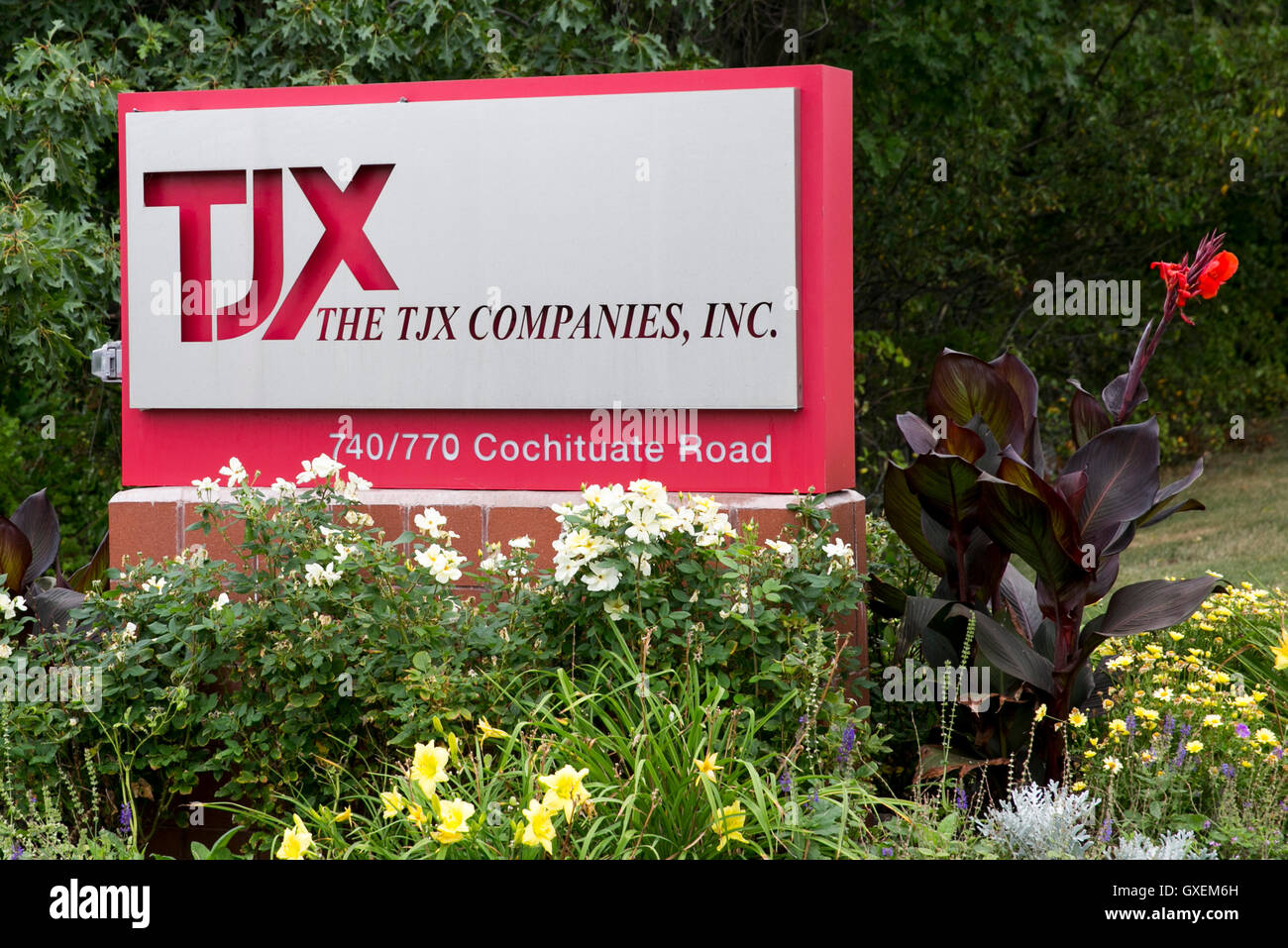 A logo sign outside of the headquarters of The TJX Companies, Inc., in