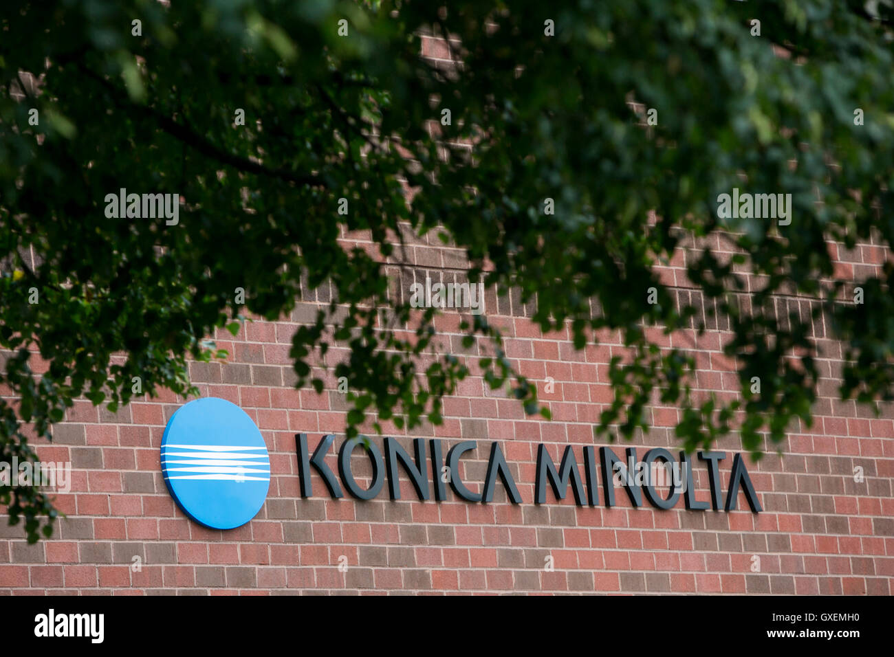A logo sign outside of a facility occupied by Konica Minolta, Inc., in Wilmington, Massachusetts on August 13, 2016. Stock Photo