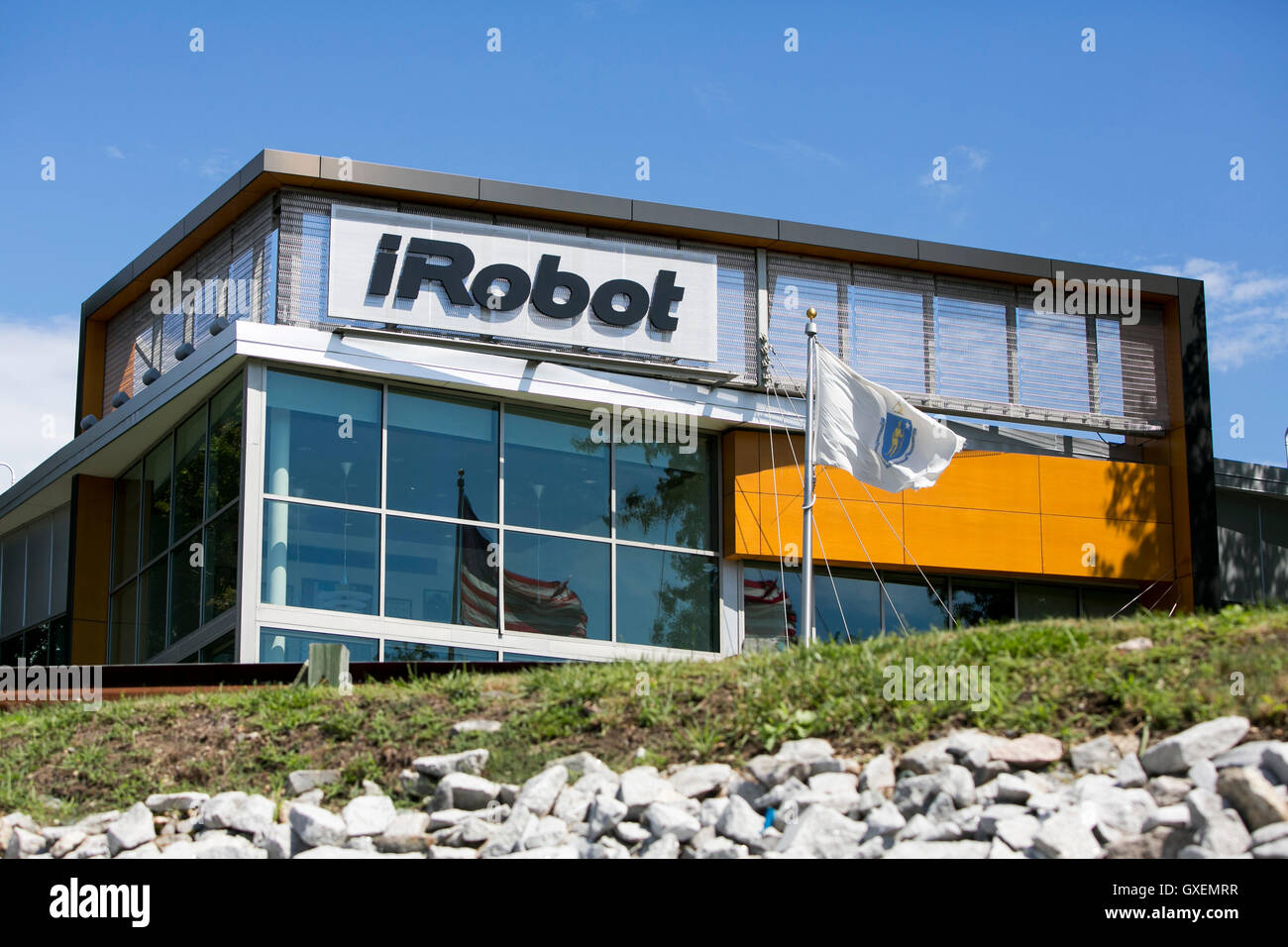 A logo sign outside of the headquarters of the iRobot Corporation in Bedford, Massachusetts on August 14, 2016. Stock Photo