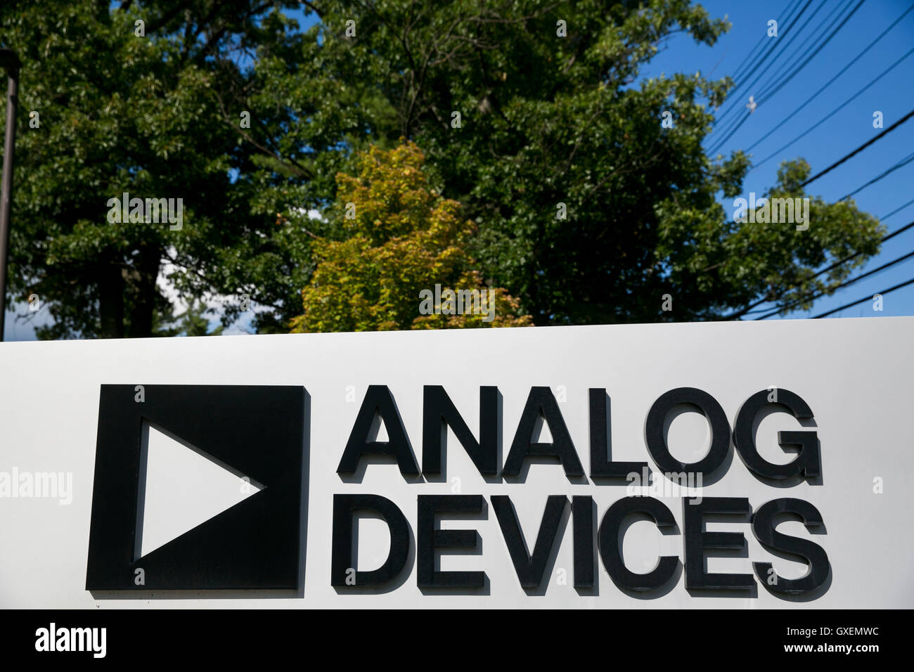 A logo sign outside of the headquarters of Analog Devices, Inc., in Norwood, Massachusetts on August 14, 2016. Stock Photo