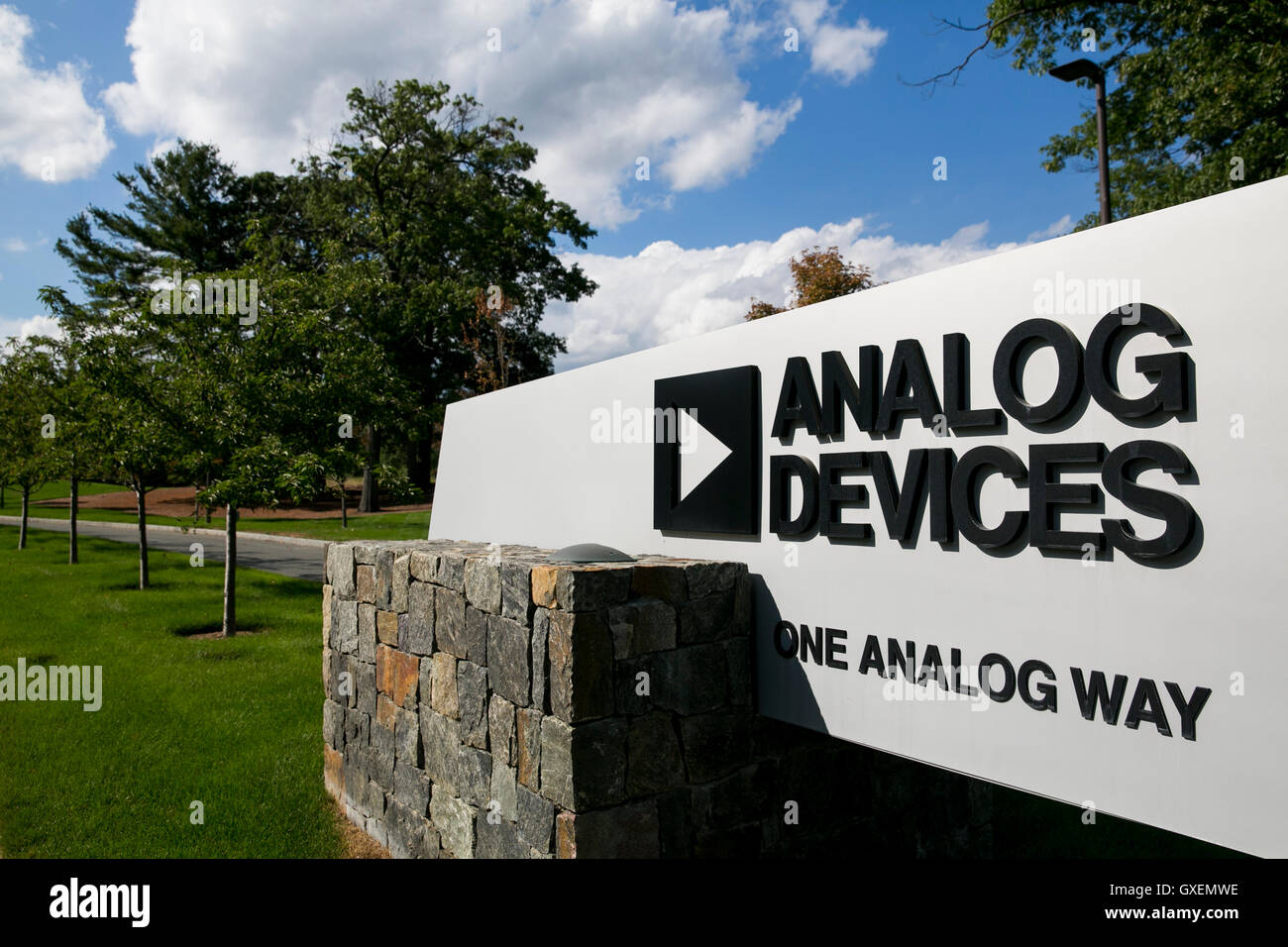 A logo sign outside of the headquarters of Analog Devices, Inc., in Norwood, Massachusetts on