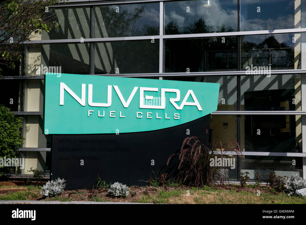 A logo sign outside of the headquarters of Nuvera Fuel Cells in