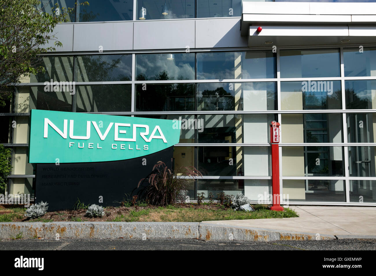 A logo sign outside of the headquarters of Nuvera Fuel Cells in