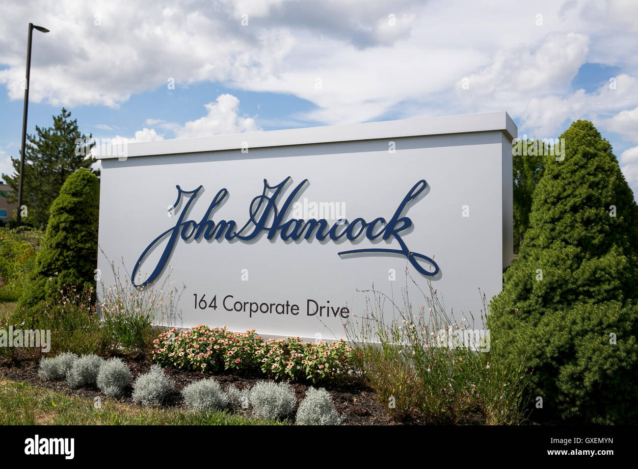 A logo sign outside of a facility occupied by John Hancock Financial in Portsmouth, New
