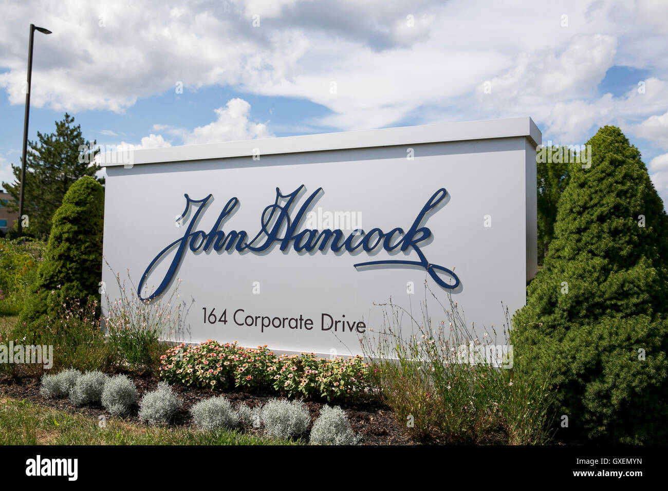 A logo sign outside of a facility occupied by John Hancock Financial in Portsmouth, New Hampshire on August 14, 2016. Stock Photo