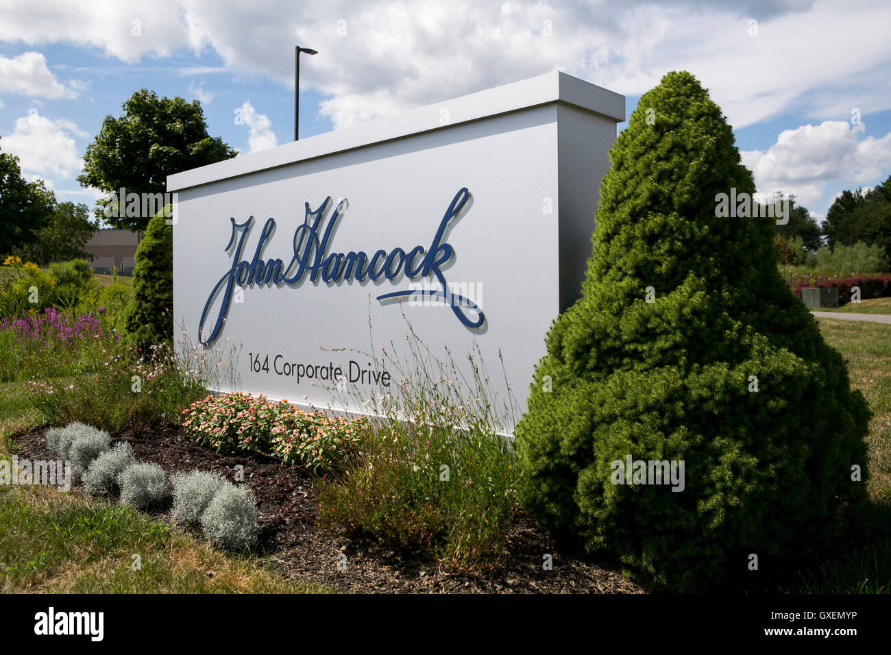 A logo sign outside of a facility occupied by John Hancock Financial in Portsmouth, New Hampshire on August 14, 2016. Stock Photo