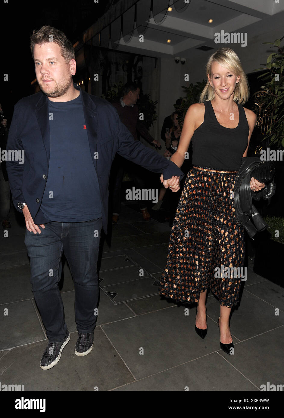 James Corden and his wife Julia Carey enjoy dinner with entrepreneur Peter Jones and his partner Tara Capp. The group were later joined by comedian David Walliams, who Corden greeted by grabbing his bum as he approached the table. After almost four hours Stock Photo