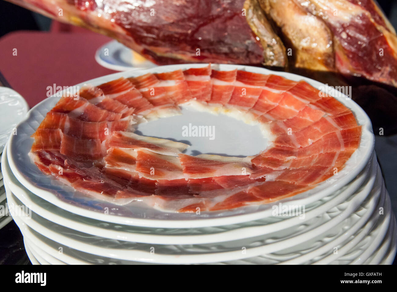 Iberian cured ham with slices plates beside. Selective focus point Stock Photo Alamy