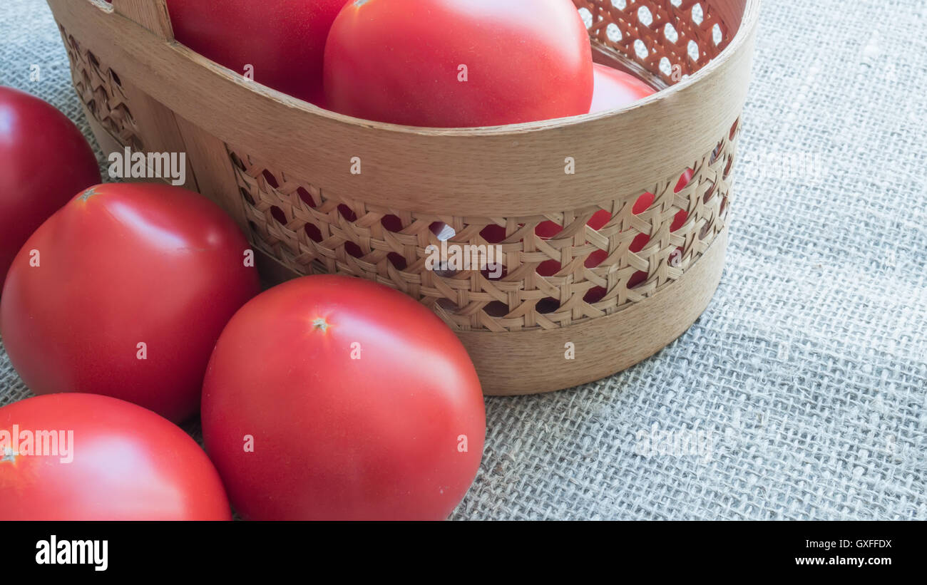 Large ripe red tomatoes in the basket Stock Photo - Alamy