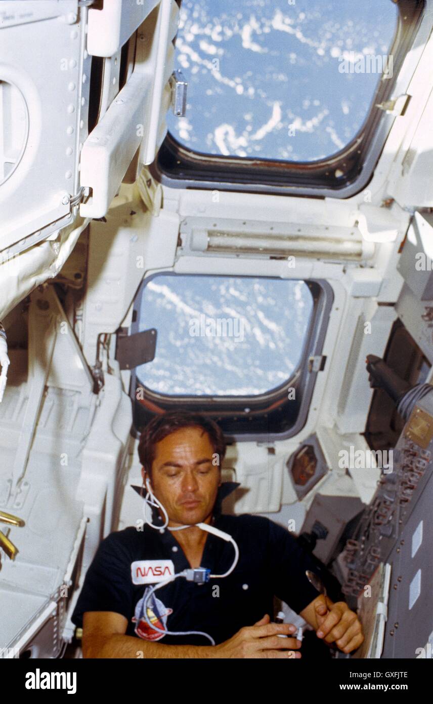 NASA Space Shuttle Columbia STS-1 astronaut Robert L. Crippen eats rehydrated food in the onboard station flight deck April 14, 1981. Crippen, along with mission commander John W. Young, manned the first American orbital spaceflight in NASAs Space Shuttle Program. Stock Photo