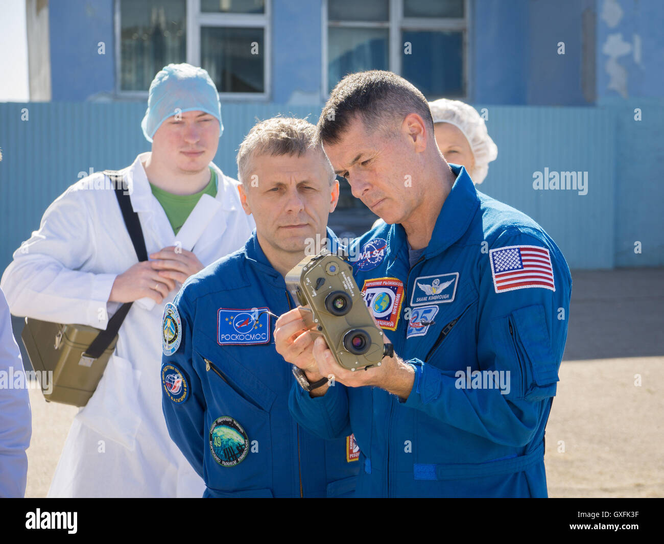 International Space Station Expedition 49 prime crew member Roscosmos cosmonaut Andrey Borisenko watches as NASA astronaut Shane Kimbrough (right) tests a pair of binoculars during pre-launch training at the Baikonur Cosmodrome Integration Facility September 9, 2016 in Kazakhstan. Stock Photo