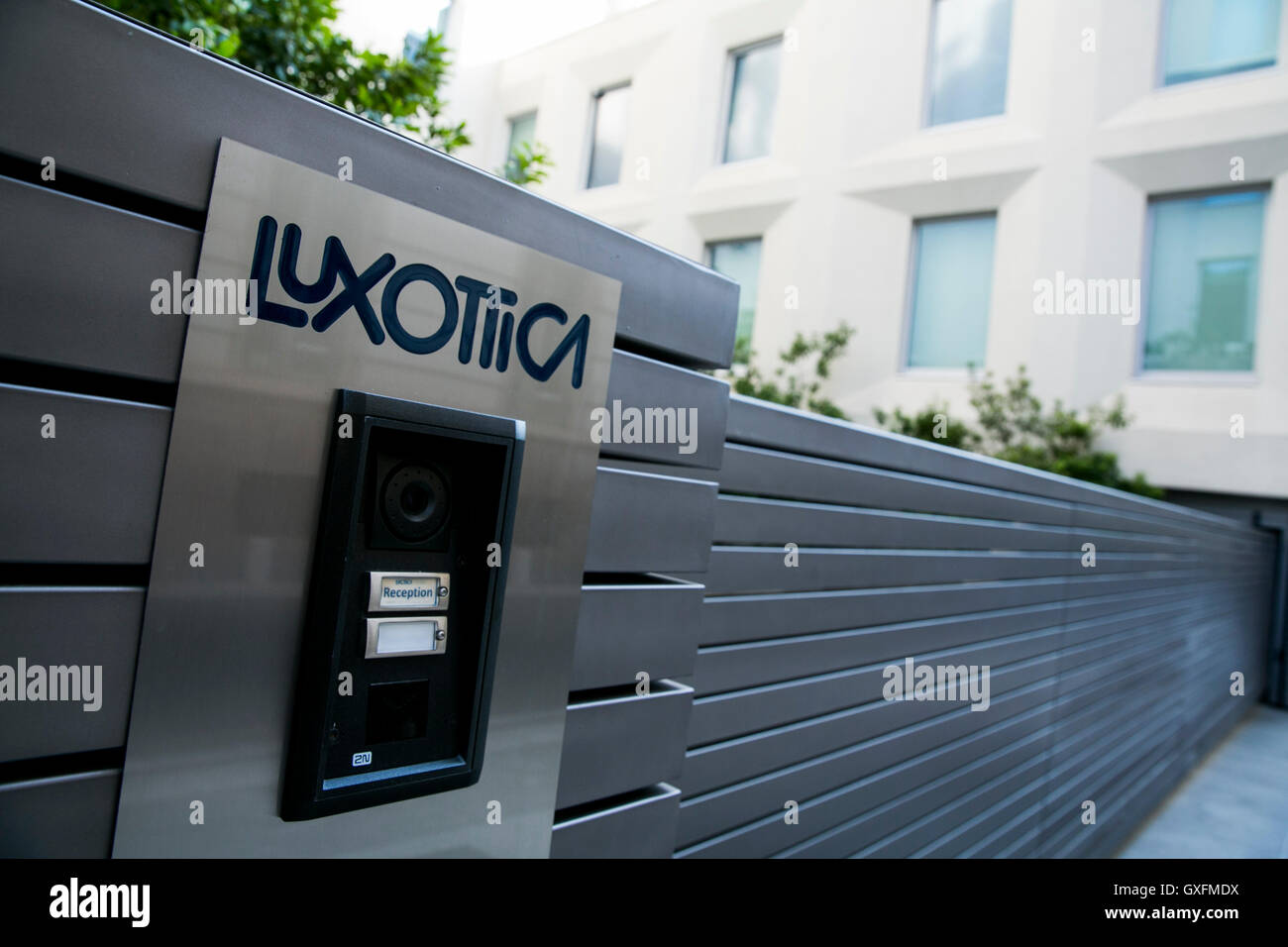 A logo sign outside of the headquarters of the Luxottica Group S.p.A