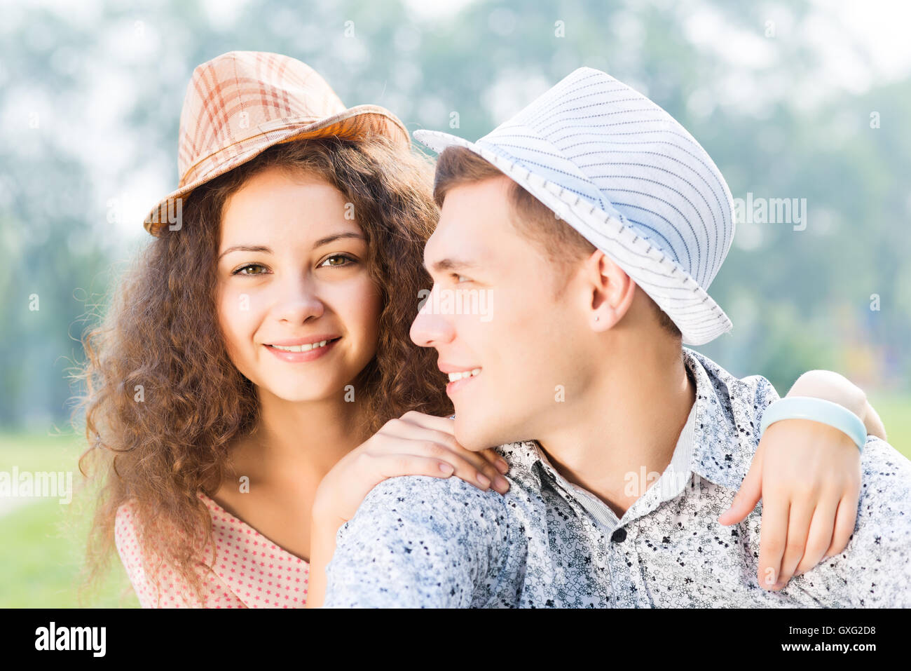 couple lying on the grass in the summer park Stock Photo - Alamy