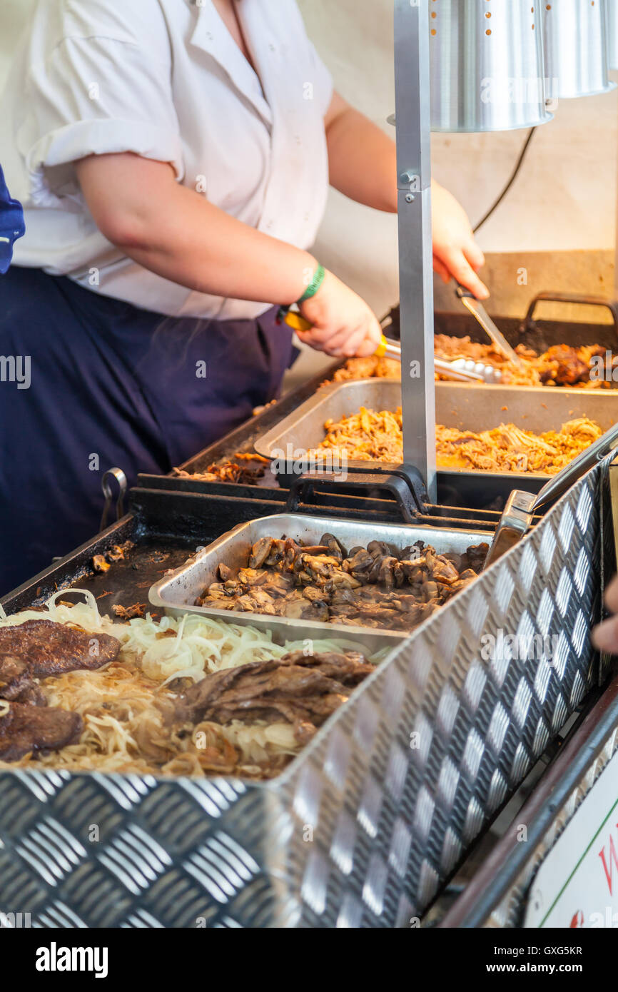 Cooking pulled pork at a food festival Stock Photo Alamy