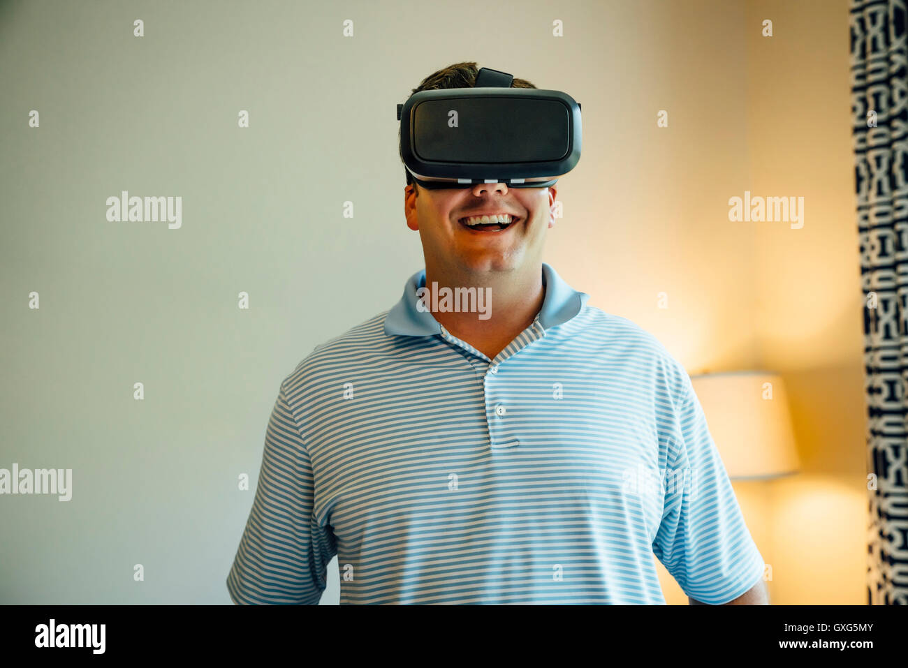 Caucasian man wearing virtual reality goggles Stock Photo - Alamy