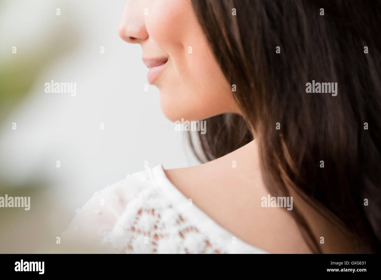 Woman smiling one shoulder hi-res stock photography and images - Alamy