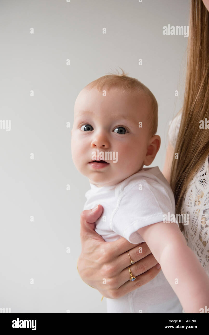 Caucasian mother holding baby boy Stock Photo