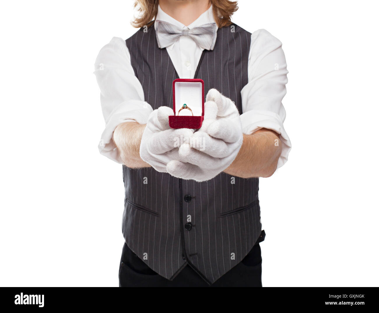 man in a bow tie holds out box with the ring Stock Photo