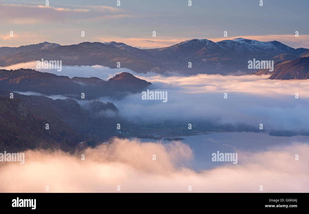 Early morning mist hangs above Derwent Water in the Lake District National Park, Cumbria, England. Autumn (November) 2014. Stock Photo