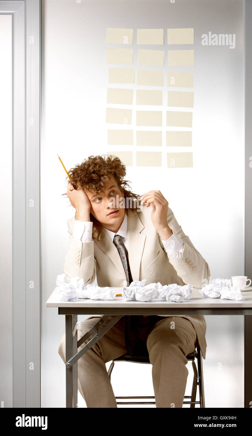 Pensive young man thinking work hi-res stock photography and images - Alamy