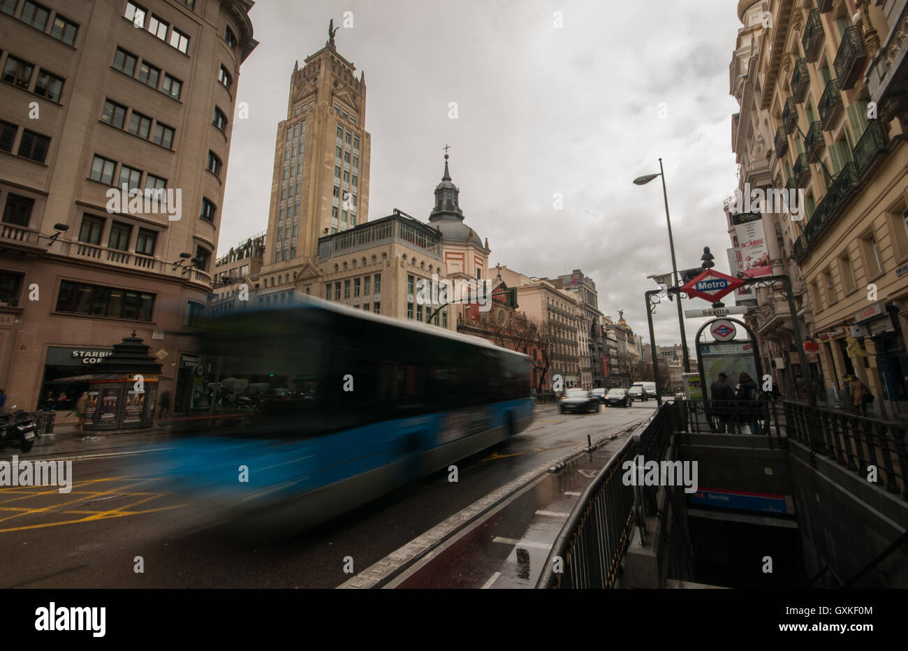 Traffic rushing past Banco de Espana metro station in Madrid, Spain Stock Photo