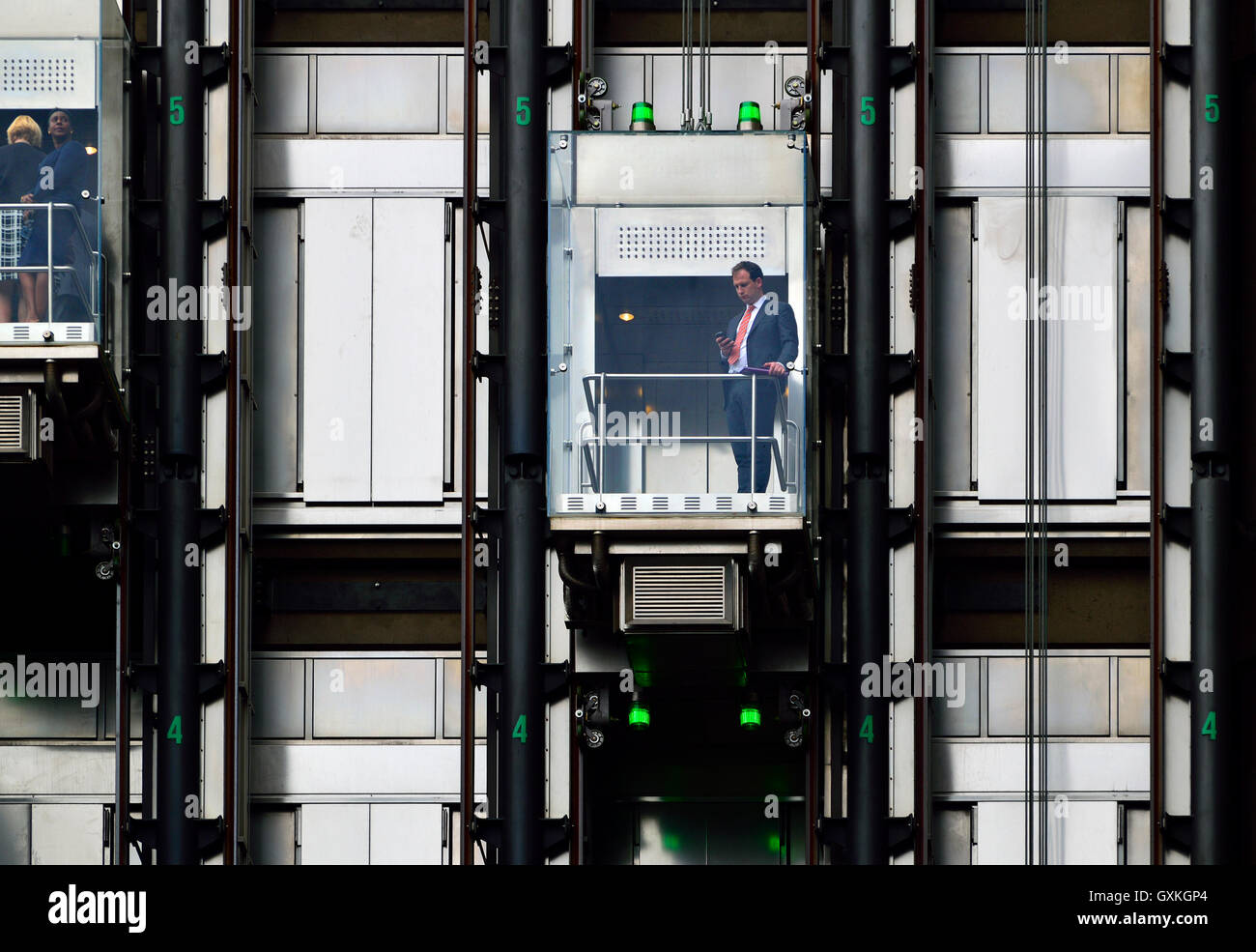 London, England, UK. Glass lifts in Lloyd's Insurance building in the City. Stock Photo