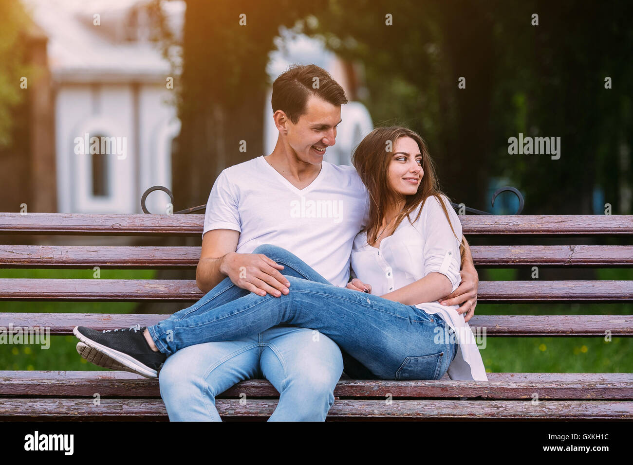 man and woman on a bench in the park Stock Photo - Alamy