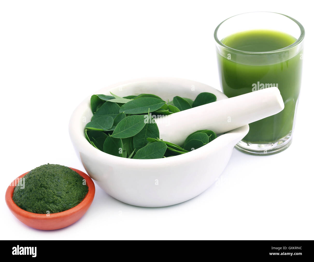 Edible moringa leaves with extract and ground paste Stock Photo