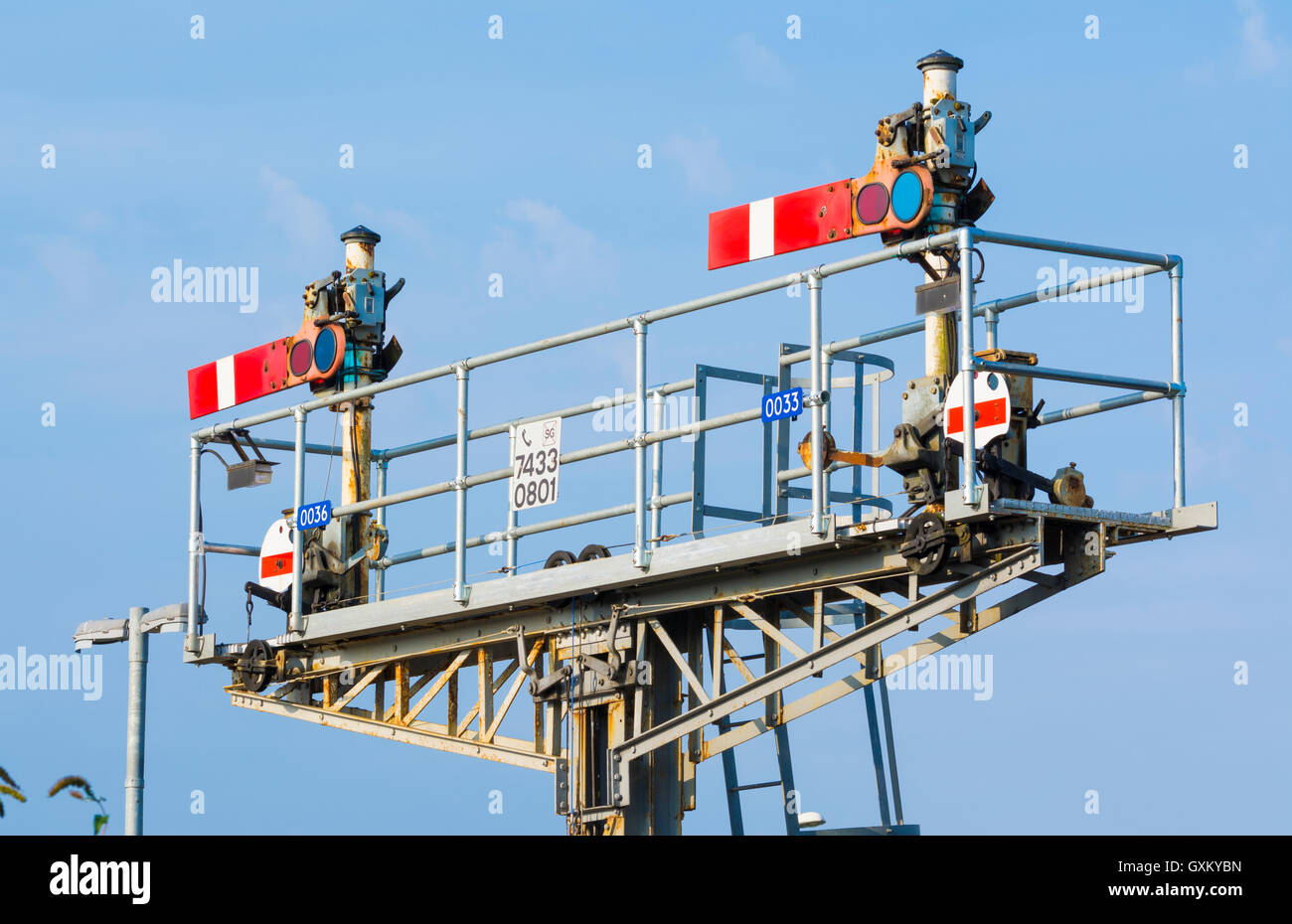 Old style semaphore stop signals on a British railway, both in the stop position, in England, UK. Stock Photo