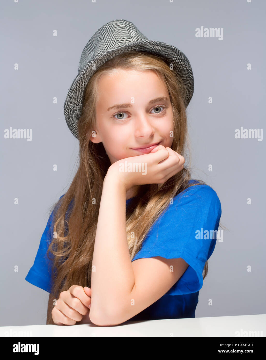 Portrait of a Beautiful Young Girl with Long Blond Hair Stock Photo