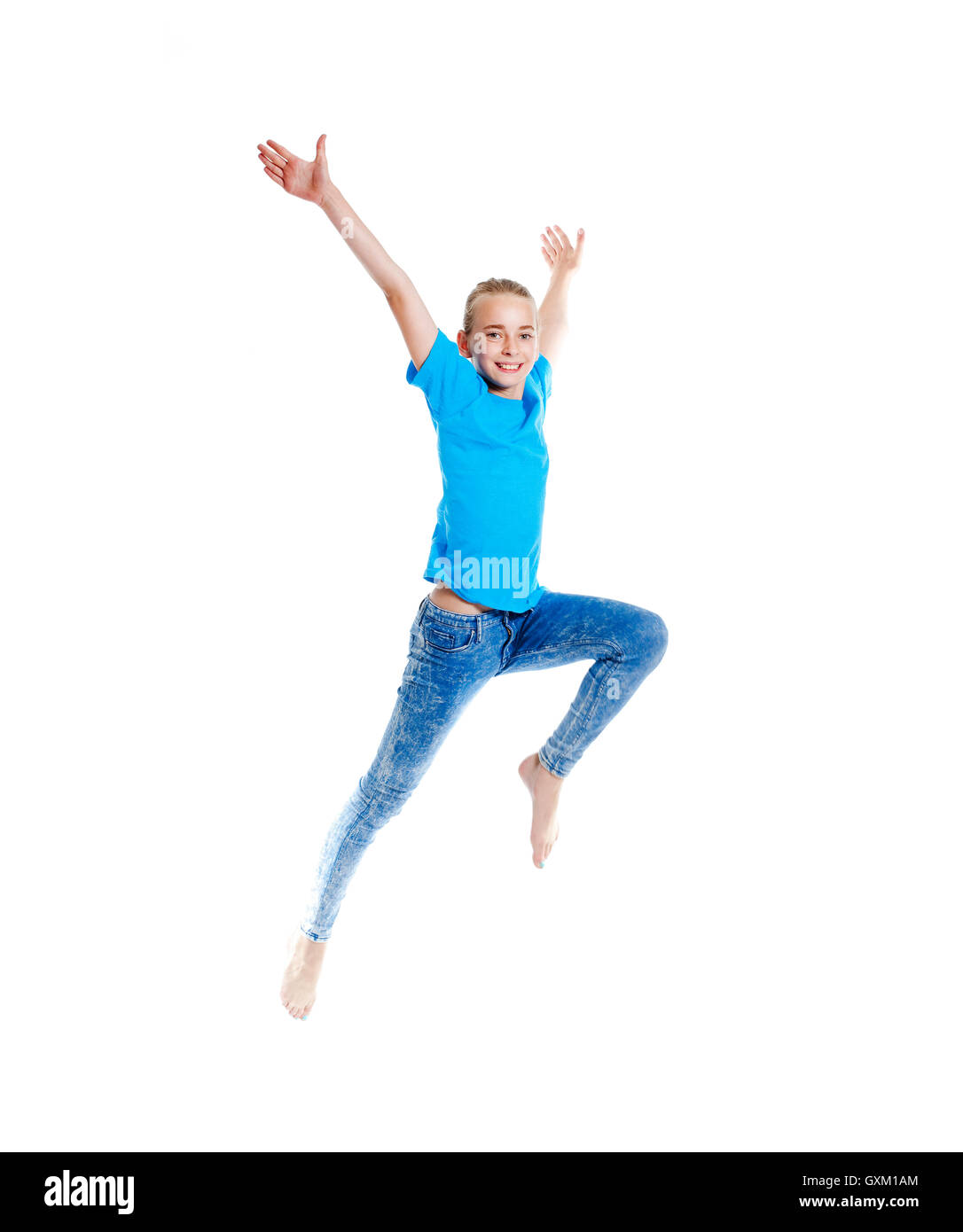Young Girl with Blond Hair Jumping in the Air Stock Photo