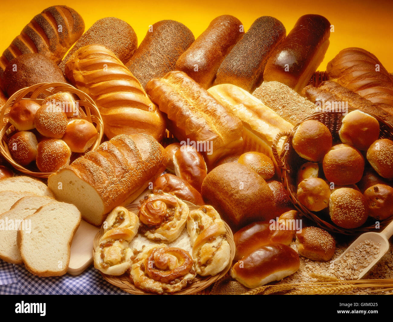 Bakery product assortment with bread loaves, buns, rolls and Danish