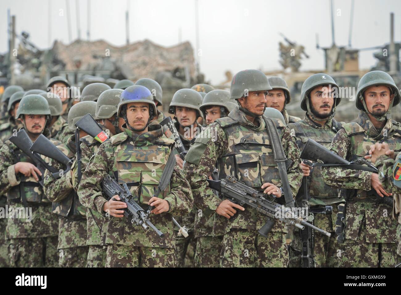 Afghan National Army soldiers stand in formation awaiting inspection at Camp Tombstone February 6, 2010 in Helmand province, Afghanistan. Stock Photo